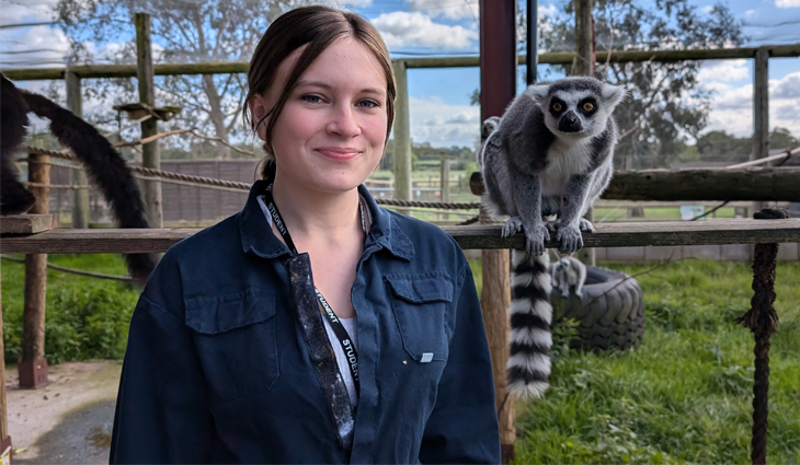 Photo of Animal Care student with Ring-Tailed Lemur