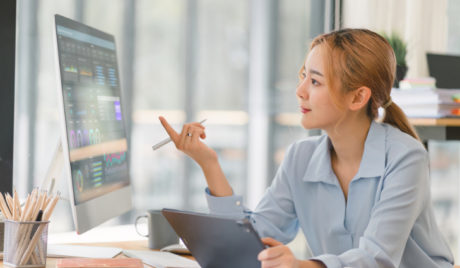 Woman using AI on computer at work