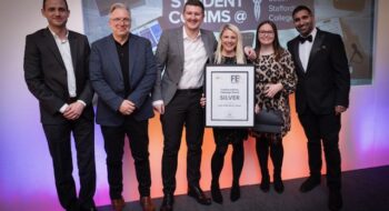 FE First awards 2025 - some of the marketing team collecting award on stage with sponsors Smart Distribution Solutions